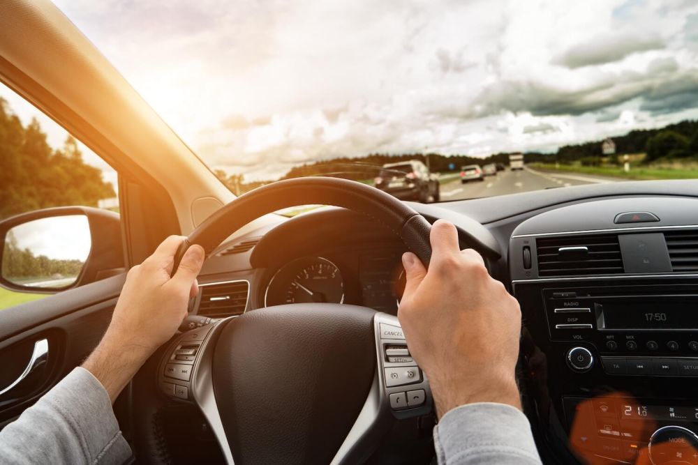 Man driving a car on the interstate