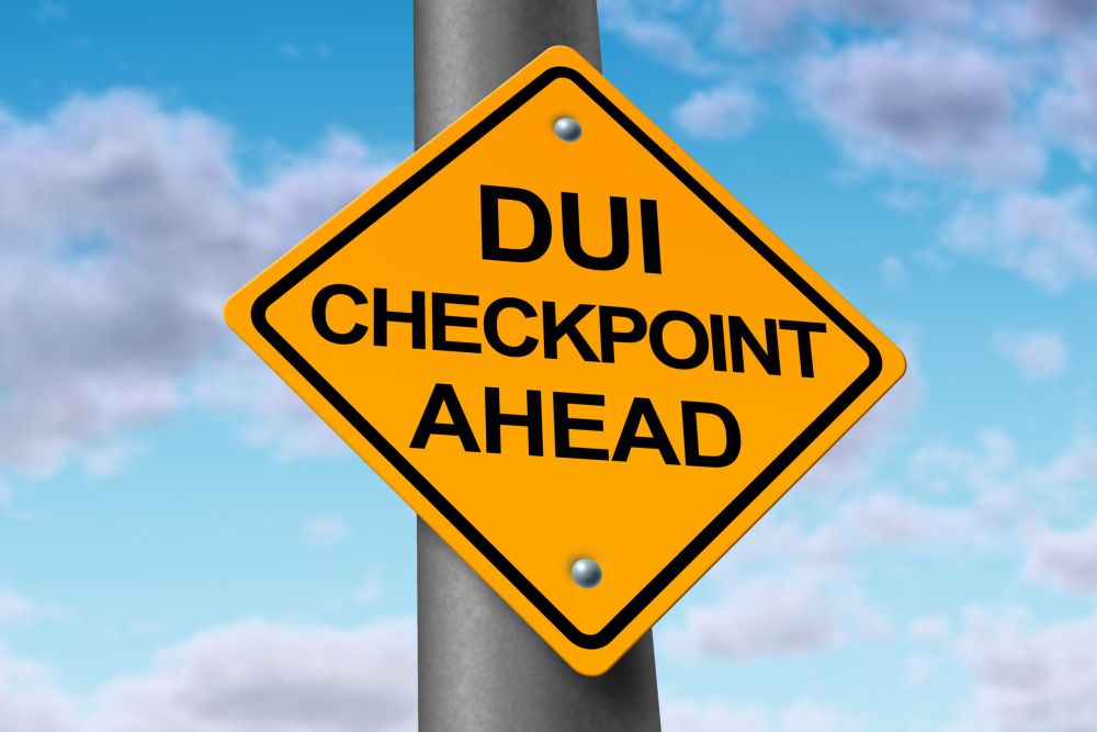 image of sobriety and drunk driving checkpoint representing the dangers of drivers that are intoxicated above the legal limit by alcohol or other drugs while they are behind the wheel of a vehicle.