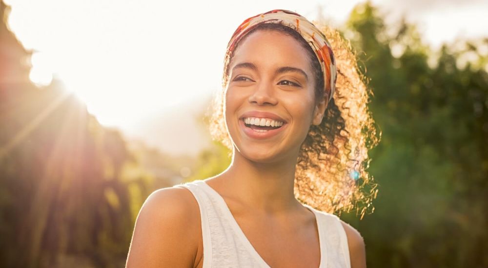 pretty woman smiling in sunlight