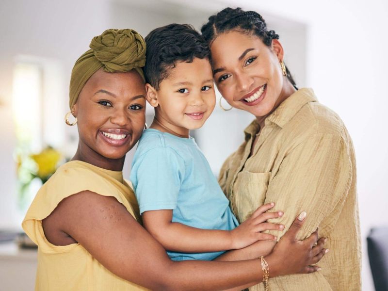 a woman and two children posing for a picture