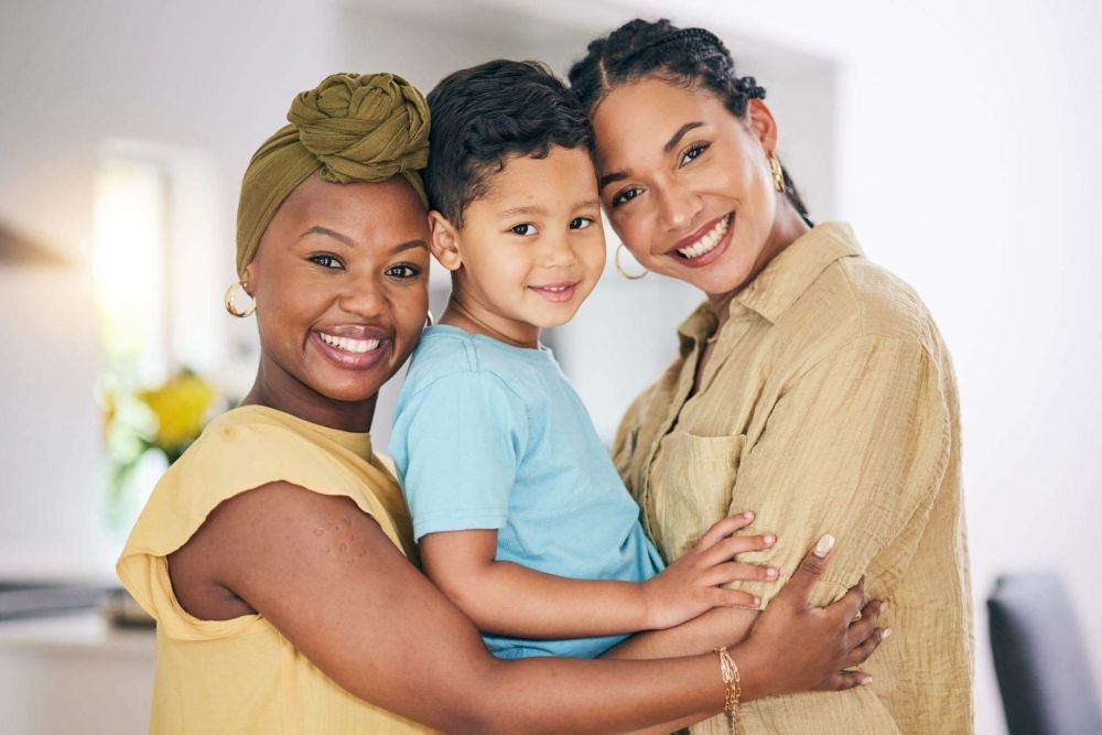 a woman and two children posing for a picture