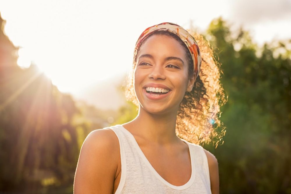 pretty woman smiling in sunlight