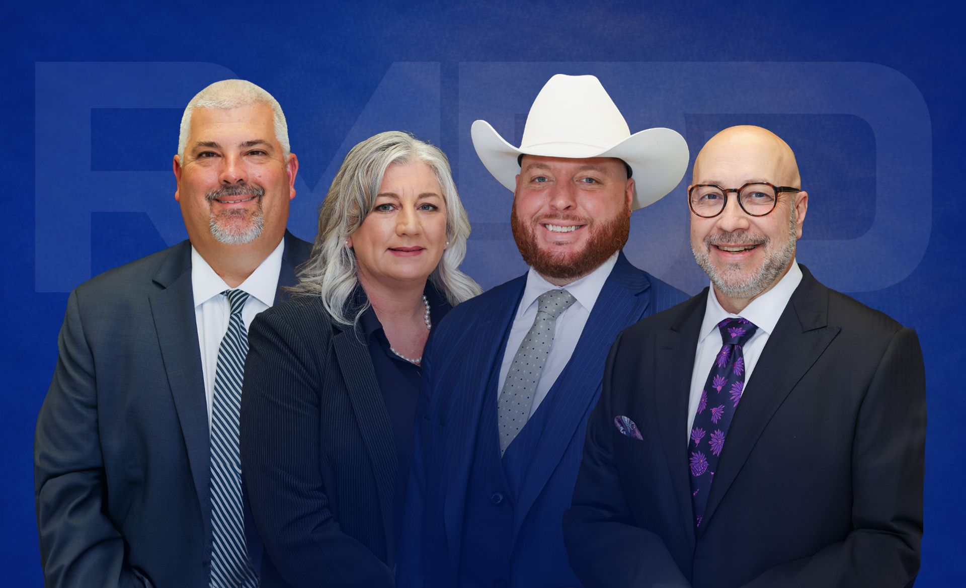 Two men and a woman in professional suits, including one wearing a white cowboy hat, pose against a blue background.