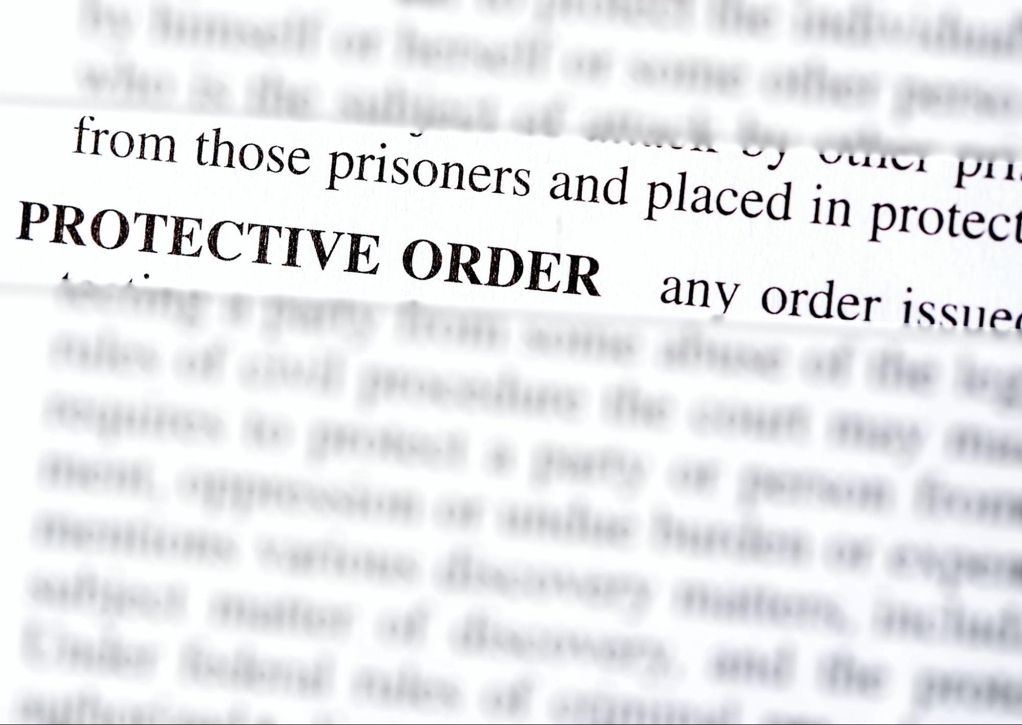 Close-up of a legal document highlighting the phrase protective order in bold letters.