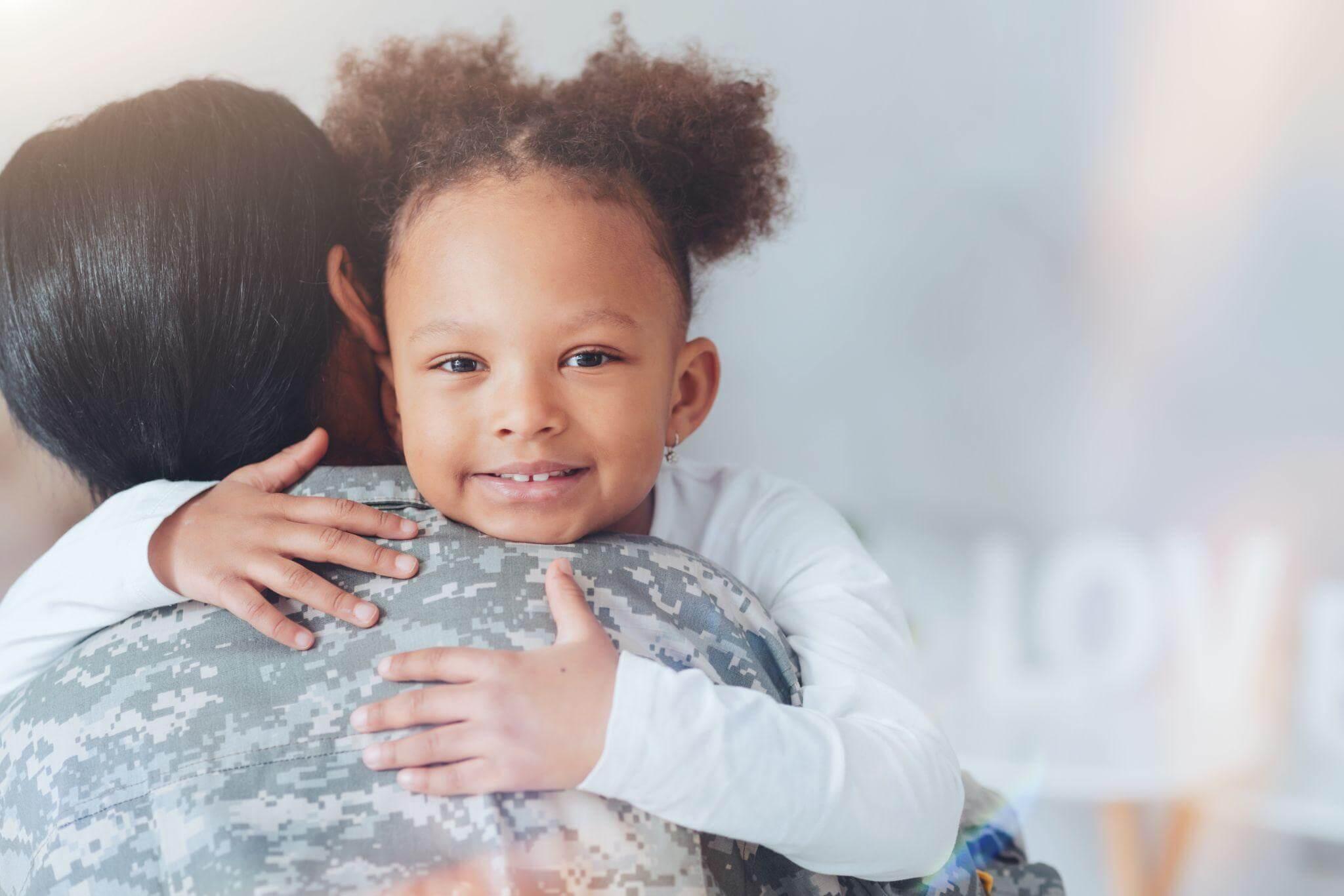 a woman holding a child in her arms